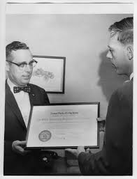 Frank Barrow Presenting Certificate to Unidentified Man