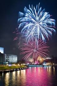 Fireworks Over The River In The City Fireworks Wallpaper Fireworks New Years Eve Fireworks