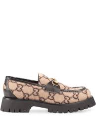 A homage to the house's heritage rooted in the equestrian world, the emblematic shape is reworked in a contemporary shape on a rubber lug sole. Gucci Gg Wool Loafer With Horsebit In Neutrals Modesens