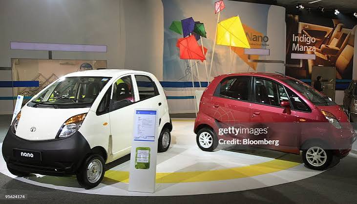 Tata Motors' Nano vehicles sit on display at the Auto Expo 2010 in... News Photo - Getty Images