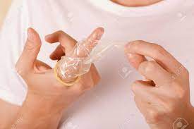 Error | please try again! Close Up Of Man Holding An Open Broken Condom With One Hand In Stock Photo Picture And Royalty Free Image Image 90869021