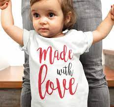 Is he hiding behind the moon? Made With Love Baby T Shirt Tenstickers