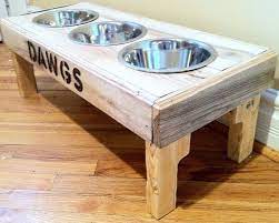 Pin By Lexy Leedom On It S All About The Dogs Diy Pallet Furniture Dog Furniture Dog Bowl Stand