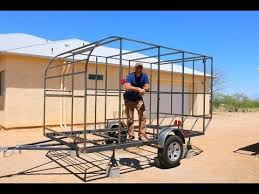 Welcome to traveling trailer designs!! After Being Gifted An Unused Axle Firefighter Joe Mooney Decided To Build An Original Small Camper In Hi Diy Travel Trailer Diy Camper Trailer Travel Trailer