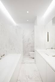 All White Marble Bathroom With Stainless Steel Touches To Make It Even More Neutral White Marble Bathrooms Marble Bathroom White Bathroom