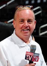 Lawrence native Holman is the beloved "Voice of the Hawks"