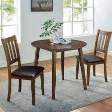 This set features a round dining table and four dining chairs. Blackwood Round 3 Piece Dining Table Set