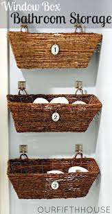 Baskets Hanging On The Wall In Bathroom For Extras Such As Toilet Paper Hair Dryer Etc Baskets Can Be Found Bathroom Basket Storage Diy Bathroom Window Box