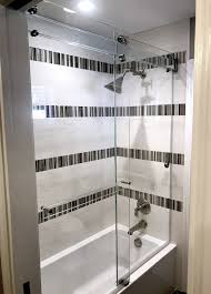 The Titan Phantom Dual Rolling Barn Door Style Shower Tub Enclosure All Glass Header Design With Glass Towel Bar Less M Tub Enclosures Shower Tub Towel Bar