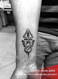 This lord shiva trishul tattoo depicts the two components of lord shiva's shape alongside rudraksh and is ideal for you on the off chance that you are an adherent of lord shiva. Custom Lord Shiva Elements Tattoo By Rahul Barve Originally Designed Skin Machine Tattoo Studio Bho Shiva Tattoo Shiva Tattoo Design Om Tattoo Design