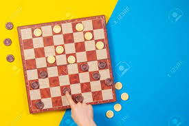 Check spelling or type a new query. Child Hands Playing Checkers On Checker Board Game Over Yellow Stock Photo Picture And Royalty Free Image Image 120722593