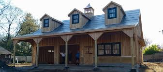 The garage design uses elements from the main residence such as the roof slope, gable end vent. Prefab Two Car Garages Custom Barns And Buildings The Carriage Shed