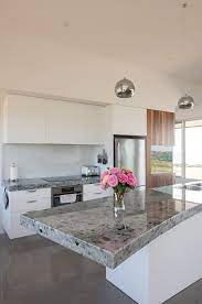 Excellent service · low prices on name brands · competitive prices Modern Kitchen With Island Bench And Chrome Pendant Lights By Rowena Naylor