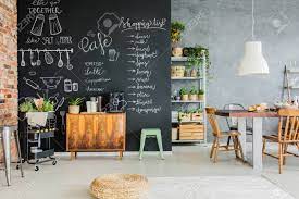 There is just something about the carefree feel a chalkboard adds to the space that speaks to me. Dining Room With Chalkboard Wall Wooden Chest And Kitchen Cart Stock Photo Picture And Royalty Free Image Image 85134313