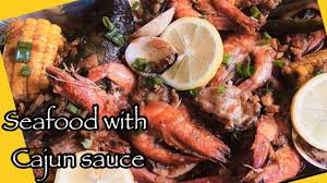 You make a flavorful sauce and cook a meat or fish in it, not so long as a braise or stew, and not so short as a sauté. Easy Way On How To Cook Seafood With Cajun Sauce Cajun Style Seafood Mix Platter Youtube