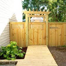 A New Fence With Built In Arbor Backyard Gates Privacy Fence Landscaping Backyard Fences