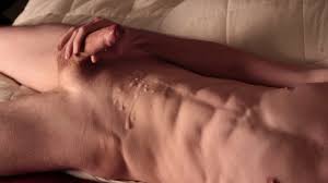 Uncut cock covers abs