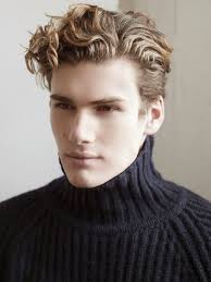 Fading out to skin at the ears and the nape offers a clean, modern finish. Teen Boy With Curly Hair