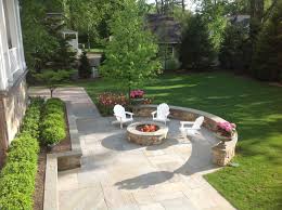 Surrounded By Simple White Adirondack Chairs This Granite Built In Firepit With Bluestone Cap Is The Centerpie Fire Pit Patio Fire Pit Lighting Fire Pit Decor