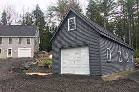 The garage doors are set in white and glass, and are fitted with black iron details that give them a cool rustic look. Great Garage Exterior Color Ideas Inspiration For Exterior Garage Colors