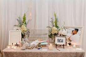 This table is what guests will see first when they arrive, and as a part of the decoration, you will need to spend some thought on it. Receiving Table With White Ivory And Pale Blue With A Touch Of Greenery Bouquet Phot Receiving Table Wedding Decor Wedding Guest Book Table Card Table Wedding