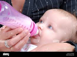 Gives baby feeding bottle hi-res stock photography and images