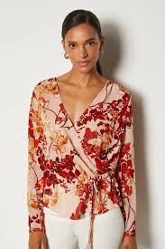 The long sleeves make up for the bare midriff, or pair your long sleeve crop top with high waisted pants or high waisted shorts for a bit more coverage. Floral Print Long Sleeve Blouse Karen Millen
