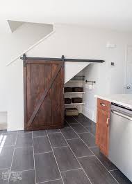 Seen on hgtv, using mason jars and the space under the upper kitchen. How To Build An Under Stairs Pantry With A Diy Sliding Barn Door The Diy Mommy