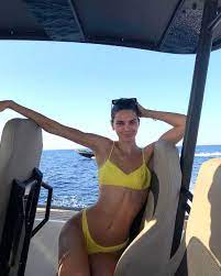 Kendall jenner flaunts her figure in sheer mini dress. From Neon Bikinis To Micro Minis Inside Kendall Jenner S Mykonos Vacation Style Kendall Jenner Ab Workout Kendall Jenner Outfits Jenner Outfits