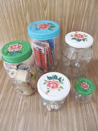 10 Ways To Upcycle Glass Bottles Jars A Cultivated Nest Upcycle Glass Decorated Jars Jar Lids