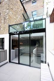 Where is the iq glass office in amersham? Using Slim Frame Sliding Glass Doors As A Facade Design Iq Glass News