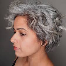 Enjoy a beachy vibe all year round with a choppy layered hairstyle featuring long curtain bangs. 33 Beautiful Grey Hairstyles For All Lengths Making Midlife Matter