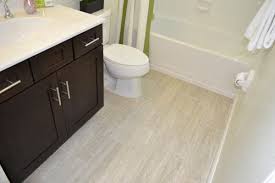 By keeping the walls and the vanity simple and neutral, the designer is able to experiment with the shower and floor tiles and create a load of visual interest with this starburst pattern. Big Tile Or Little Tile How To Design For Small Bathrooms And Living Spaces On Suncoast View Tile Outlets Of America