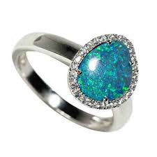 You can find unique opal rings with pink or even blue color tones. Glowing Moon Waters Sterling Silver White Topaz Australian Opal Ring