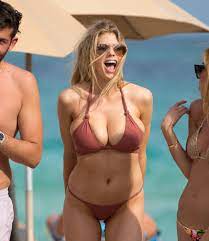 Charlotte McKinney almost spills out of her bikini top as she frolics on  the beach in tiny swimsuit | The Irish Sun