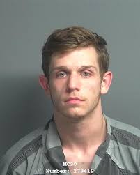 STRADER ADAM DOUGLAS was booked into the Montgomery County Jail