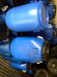 Bucket grid and features white child warning label on its side. Plastic Drums New Used Mak Enterprises