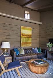 Baxton studio helene velvet storage bench. The Power Of Materials Is On Display At An Architect S Alabama Lake Home Cozy Sitting Room With Horizontal Wood Paneling Tufted Leather Sofa And Industrial Drum Coffee Table Luxe Interiors Design