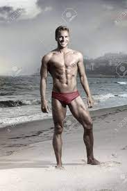 Comes with smiling face plate which is interchangeable with face plates from figma groom. Dramatic Fashion Portrait Of Athletic Fit Male Model On Beach In Bikini Swimwear Stock Photo Picture And Royalty Free Image Image 13929892