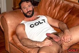 Amazing gay porn star Wilfried Knight demonstrates his nude hairy chest