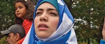 Might it make more sense to make wearing religious insignia compulsory?'