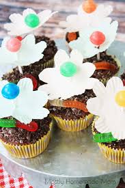 Cupcake liner flowers with lollipops. Lollipop Flower Cupcakes Mostly Homemade Mom