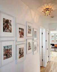 Photowall ideas display family photos family pics display pictures family collage displaying photos on wall family tree wall family a hallway makes for a great place to hang some pictures of friends and family. A S H L E Y P E T R O N E On Instagram So Far Three Of These Frames Have Fallen Due To Wild Hallway Wall Decor Gallery Wall Layout Family Pictures On Wall