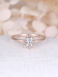 14 Of The Chicest Under 1700 Engagement Rings On Etsy Rose Engagement Ring Moissanite Engagement Ring Rose Gold Moissanite Engagement Ring Oval