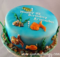 Handpainted sugar fish swim around the sides and an edible life preserver hangs on a piling. Yummy Thingy Aquarium Fish Theme Cake Fish Theme Cake Fish Cake Birthday Aquarium Cake