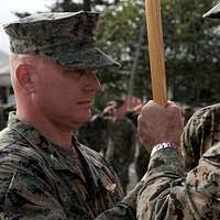 U.S. Marine Corps Cpl. Riley Chastain, center, and