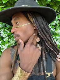 Face adornments made with stainless steel, crystals, and feathers