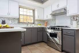 My kitchen is very similar, in fact i have the same pendants over a lighter gray island in my kitchen surrounded by white shaker style cabinets! Grey White Kitchen Remodel Klassisch Modern Kuche Sonstige Von Kitchen Magic Houzz