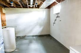 The wall is on a slope, but it is indeed level (the first layer of cinder blocks stairsteps up). Painting Cinder Block Walls In A Basement Or Re Paint Them