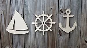 Check out our nautical theme decor selection for the very best in unique or custom, handmade pieces from our shops. Amazon Com Wooden Sailboat Ship Wheel And Anchor Set Nautical Wall Decor Wood Nautical Decor Nautical Decor Nursery Decor Beach House Decor Ocean Theme Decor 8 Or 10 Handmade